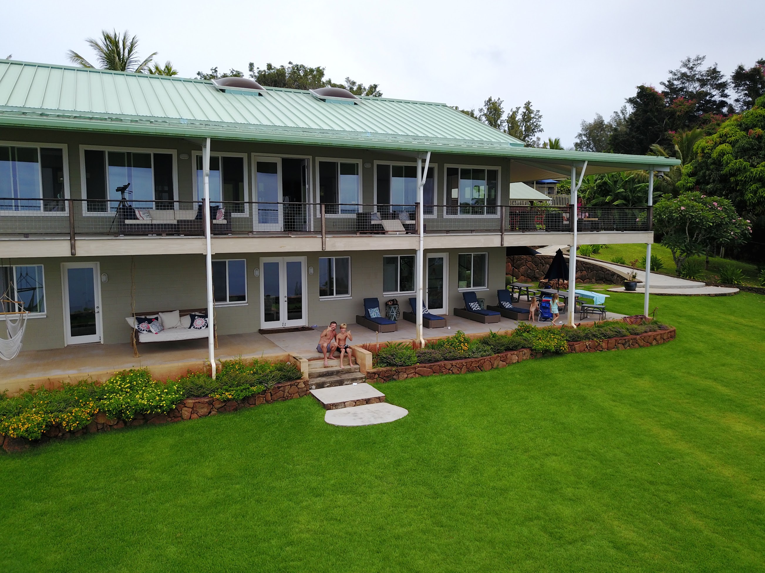 Whale House property grounds with lush tropical landscaping